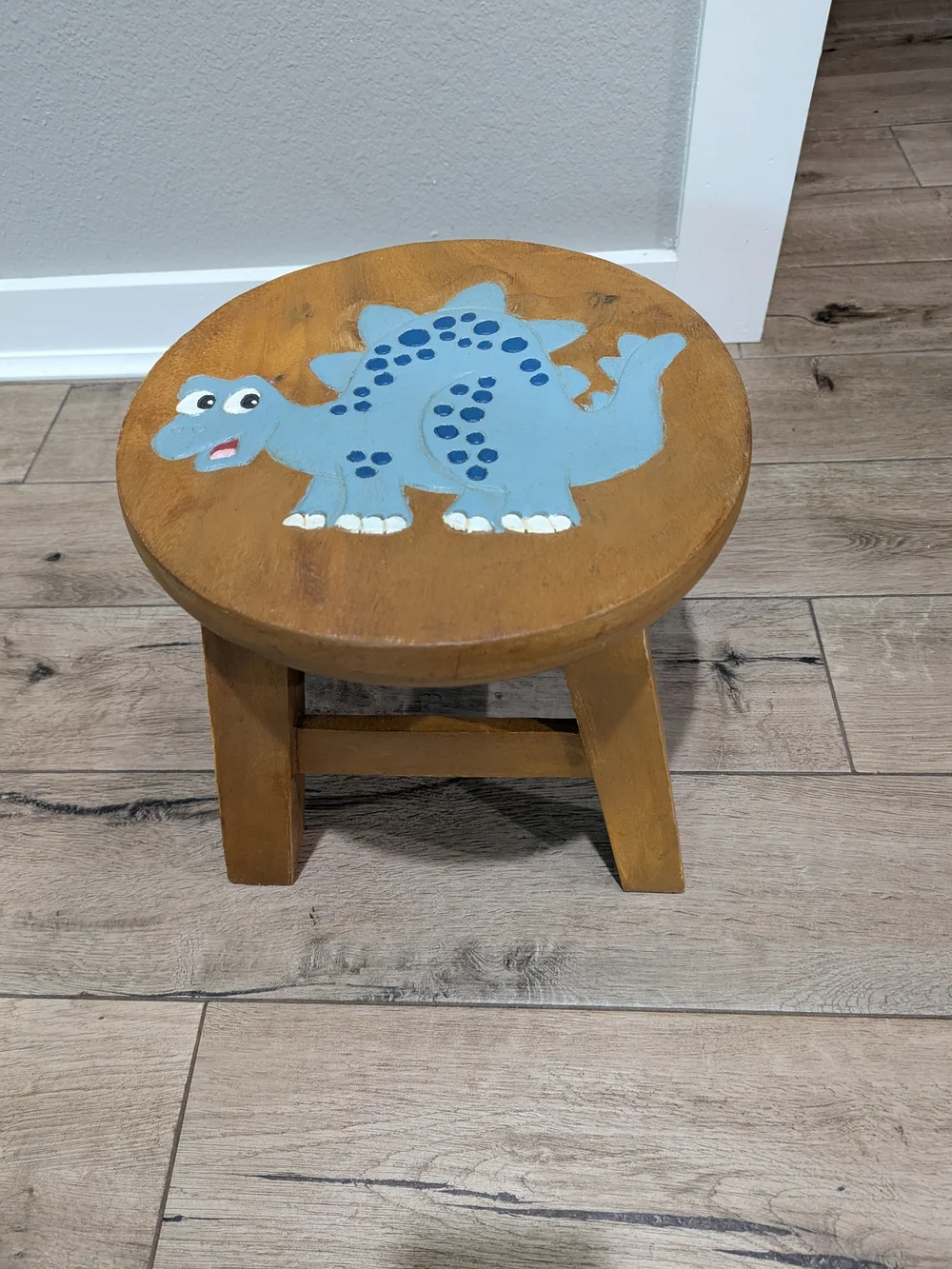 Carved Painted Brown Wooden Kids Stool with Blue Dinosaur